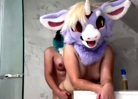 Kinky masked couple enjoying doggystyle sex in the shower